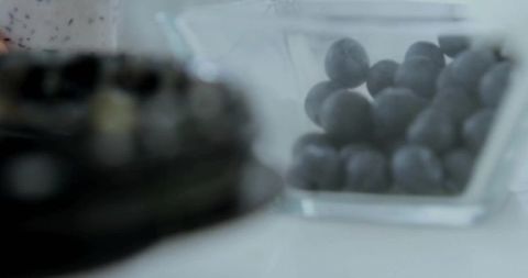Organic Blueberries in Clear Bowl Complementing Gourmet Experience