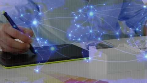 Graphic Designer Using Tablet with Global Network Visual