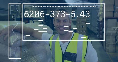 Warehouse worker smiling while leaning on wrapped pallet with digital hud overlay