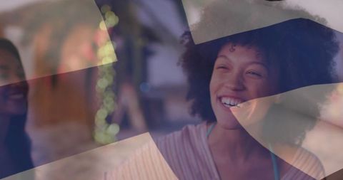 Smiling curly-haired woman enjoying cozy lounge bokeh lights with modern geometric overlay