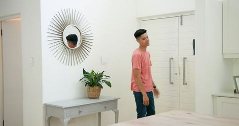 Young Friends Enjoy Welcoming Conversation at Home Entrance
