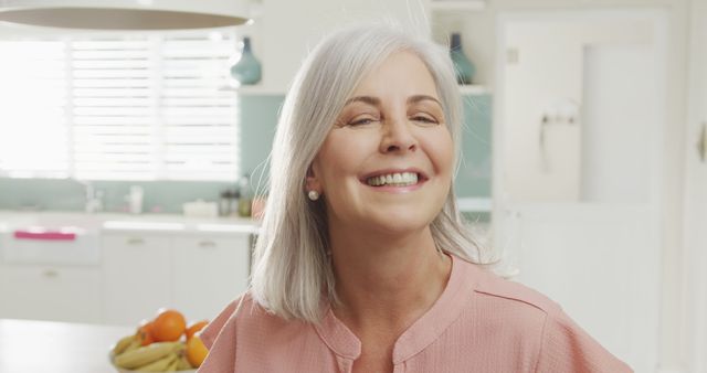 Portrait of happy senior caucasian woman smiling. Spending quality time at home and retirement concept.