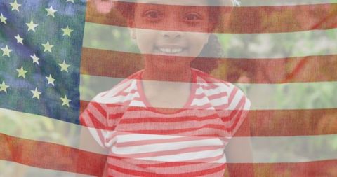 Smiling African American Girl with US Flag Overlay