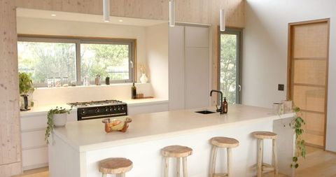 Minimalist Kitchen Featuring Spacious Island and Sleek Design