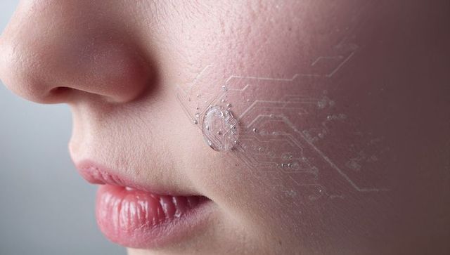 Closeup of female lower face with transparent electronic skin patch and circuit contacts