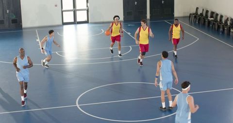 Diverse Basketball Team Playing Intense Game in Gym
