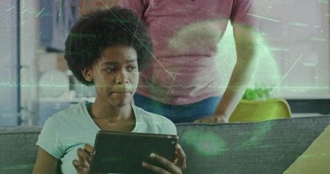 Teen Using Tablet with Parent Overseeing and Digital Data Overlay for EdTech Home Learning