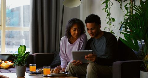 Couple Exploring Digital Content Tablet at Cozy Morning Breakfast - Download Free Stock Images Pikwizard.com