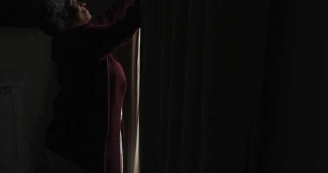 Older Woman Closing Curtains in Dark Room - Download Free Stock Images Pikwizard.com