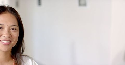 Businesswoman Smiling Confidently in Modern Office