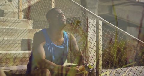 African american man taking water break outdoor fitness reflecting nature