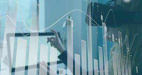 Analyst wearing blazer using VR headset and tablet with financial chart and data overlay