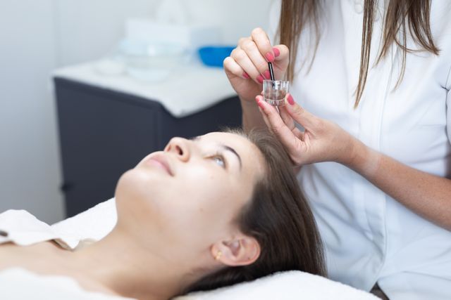 Beautician Preparing Facial Treatment for Woman at Salon - Download Free Stock Photos Pikwizard.com