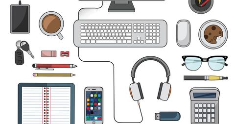 Organized workspace essentials with notepad and gadgets