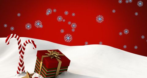 Festive Candy Canes and Gift Box on Snowy Red Background