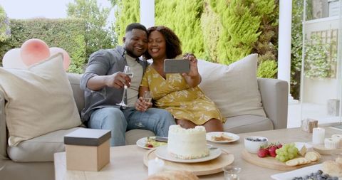 Romantic Couple Enjoying Dessert and Wine on Patio