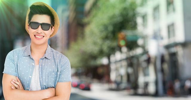 Digital composition of cheerful man in sunglasses and straw hat standing with arms crossed in a street