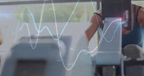 Woman training on cardio machine with fitness analytics overlay and performance graphs