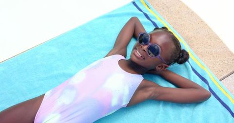 Children Sunbathing by Pool in Stylish Swimwear and Sunglasses