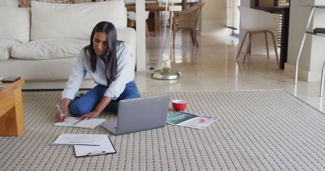 Woman Working from Home Taking Notes in Living Room - Download Free Stock Images Pikwizard.com