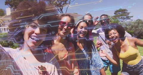 Friends Taking Selfie with Digital Overlay in Vibrant Backyard Gathering
