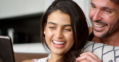 Joyful Couple Sharing Relaxed Home Moment - Download Free Stock Images Pikwizard.com