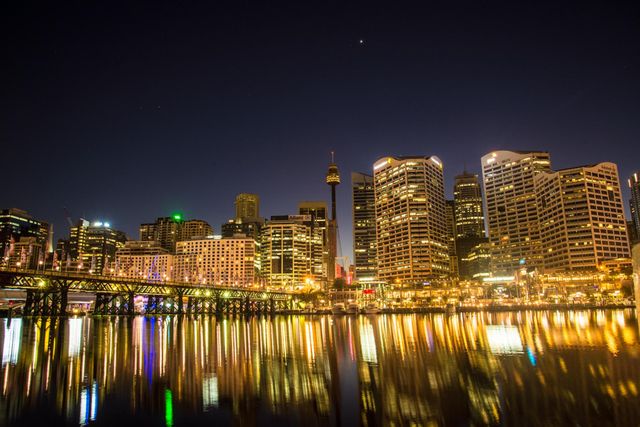 Vibrant City Skyline Reflected in Nighttime Waterscape - Download Free Stock Photos Pikwizard.com