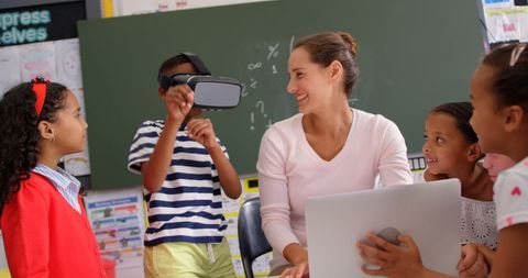 Engaged Students Exploring Virtual Reality in Classroom with Teacher