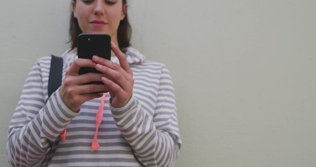 Young Woman Using Smartphone Against Neutral Background - Download Free Stock Images Pikwizard.com