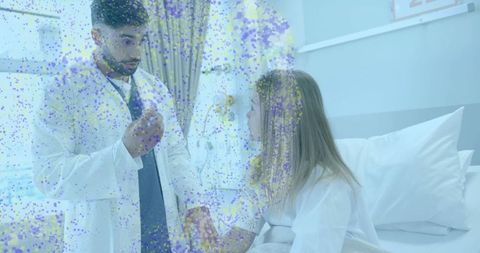 Doctor explaining medication to hospital patient during bedside consultation