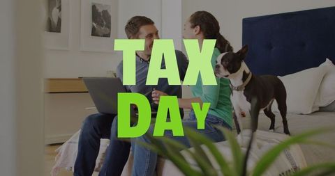 Diverse Couple Celebrating Tax Day on Laptop with Dog