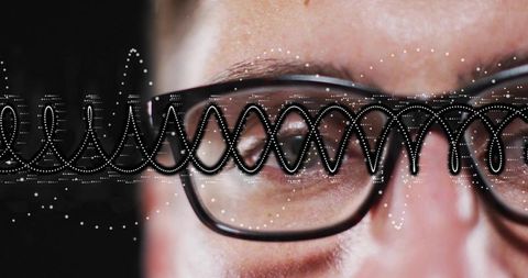 Closeup Male Wearing Black Glasses Showing Dotted Digital Waveform Reflections Over Eyes
