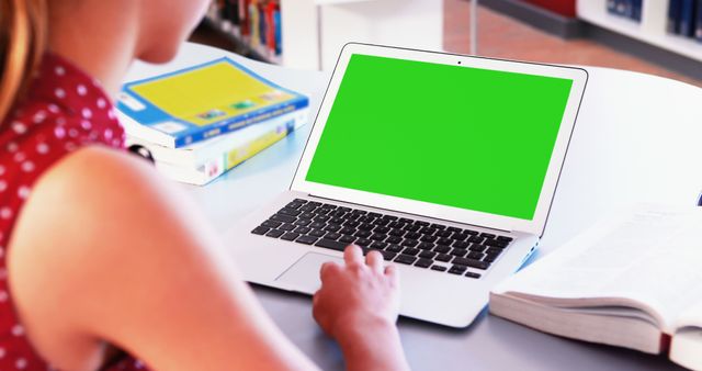 Student Using Laptop With Green Screen in Library - Download Free Stock Images Pikwizard.com