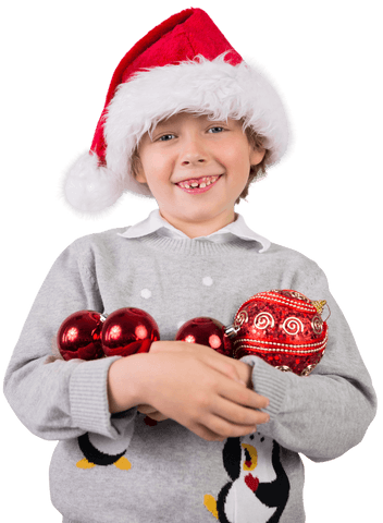 Smiling Boy with Christmas Hat Holding Ornaments Transparent Background