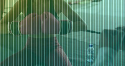 Male athlete performing dumbbell chest press on bench with spotter in home gym training