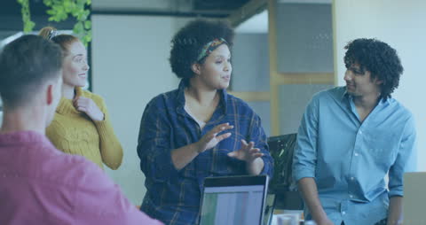 Creative Team Collaborating in Modern Office with Digital Data Overlay