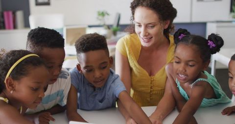 Diverse Group of Children Learning with Teacher - Download Free Stock Images Pikwizard.com