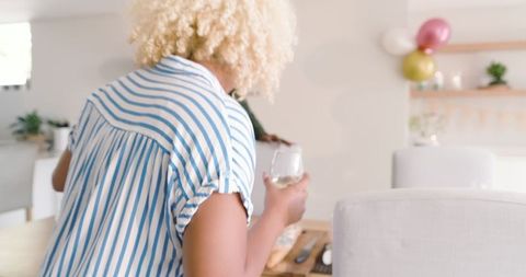 African American Friends Enjoying Cheerful Home Gathering