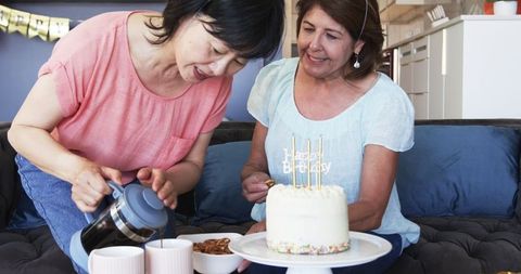 Senior Friends Celebrating Birthday with Coffee and Cake