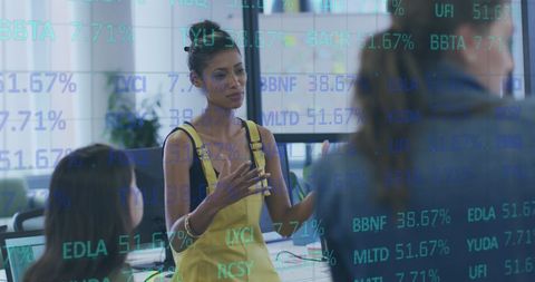 Diverse Team Collaborating on Data Processing in Office