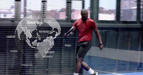 Athlete sprinting on indoor court with holographic globe overlay and wearable fitness tech