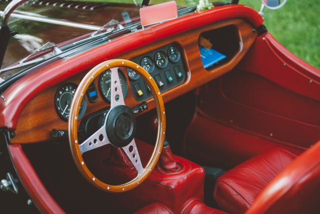 Classic Vintage Car Interior with Red Leather Seats and Wooden Steering Wheel - Download Free Stock Photos Pikwizard.com