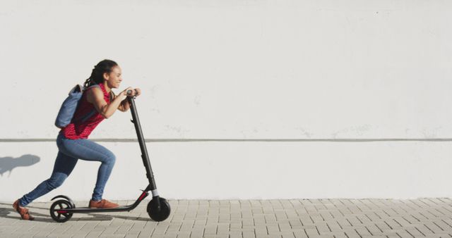 Young Woman Riding Electric Scooter on Sunny Day - Download Free Stock Images Pikwizard.com