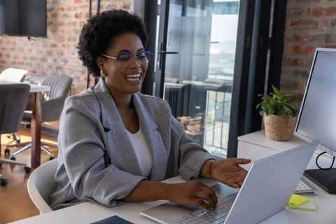 African American Businesswoman Engaging During Virtual Meeting