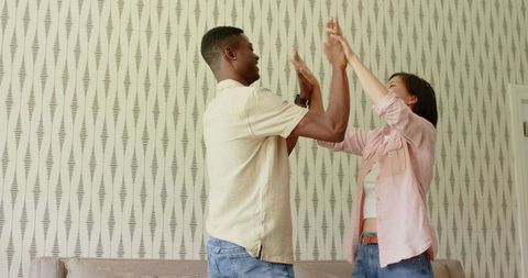 Happy Couple Celebrating and Sharing Laughter