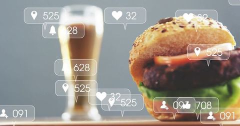 Showcasing sesame burger and beer with floating social media notifications for food brand