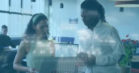 Diverse Professionals Analyzing Data in Modern Office Lounge