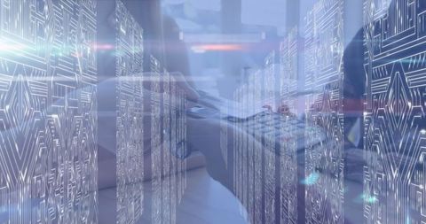 Futuristic IT Professional Typing Amidst Digital Circuit Overlay