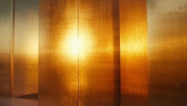 Golden Metal Panels Glowing in Sunlight Outdoors