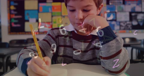 Young Boy Focuses on Learning Mathematics in Classroom